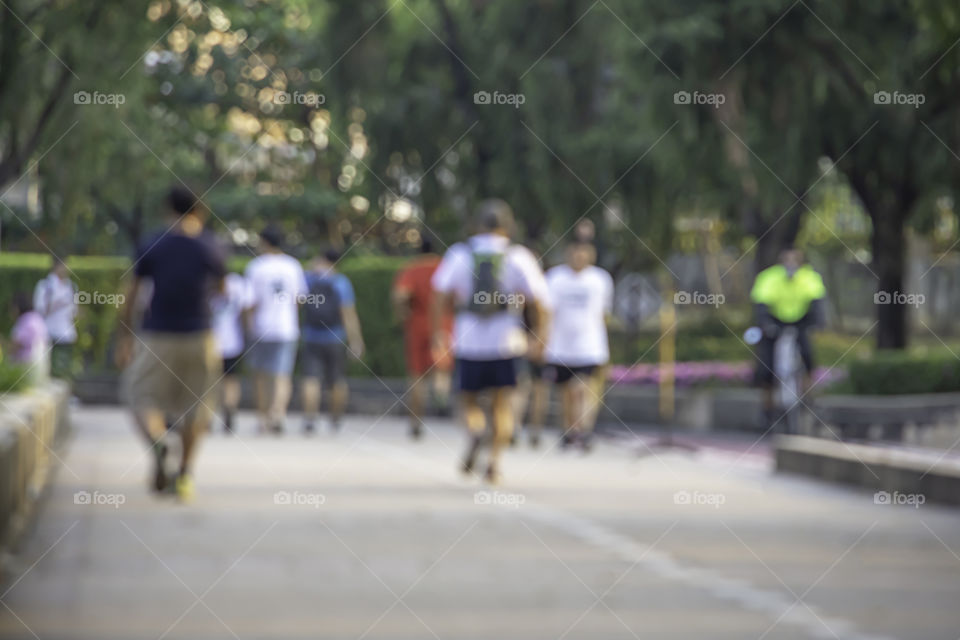 Blurry image people running exercise for health in the Benjakitti Park , Bangkok in Thailand.