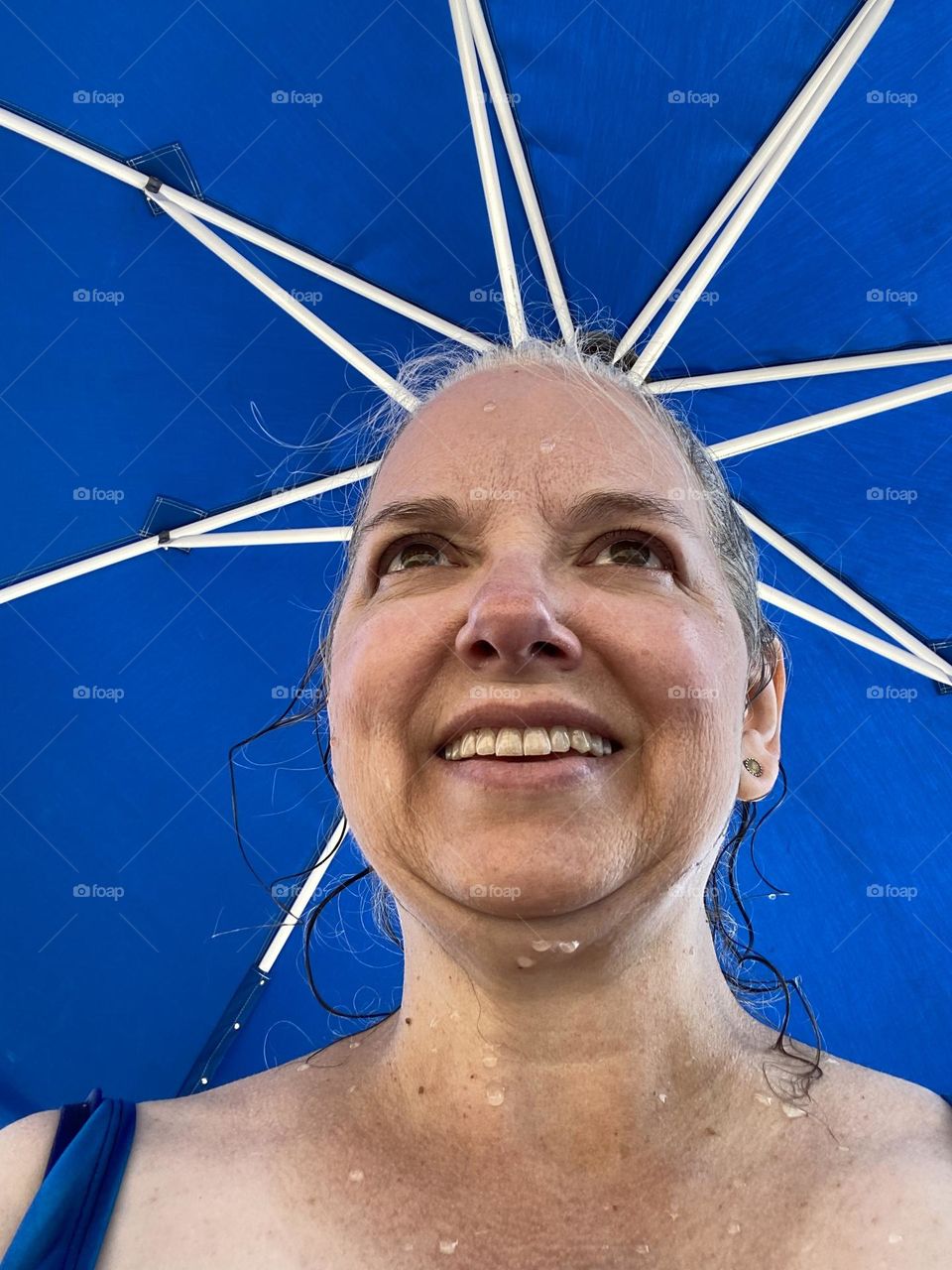 Me, under a bright blue umbrella “crown” by the pool at a local park after a morning swim. I had not been swimming in a long time and had forgotten how much I loved it. It was just the thing to lift my spirits on a hot summer day.