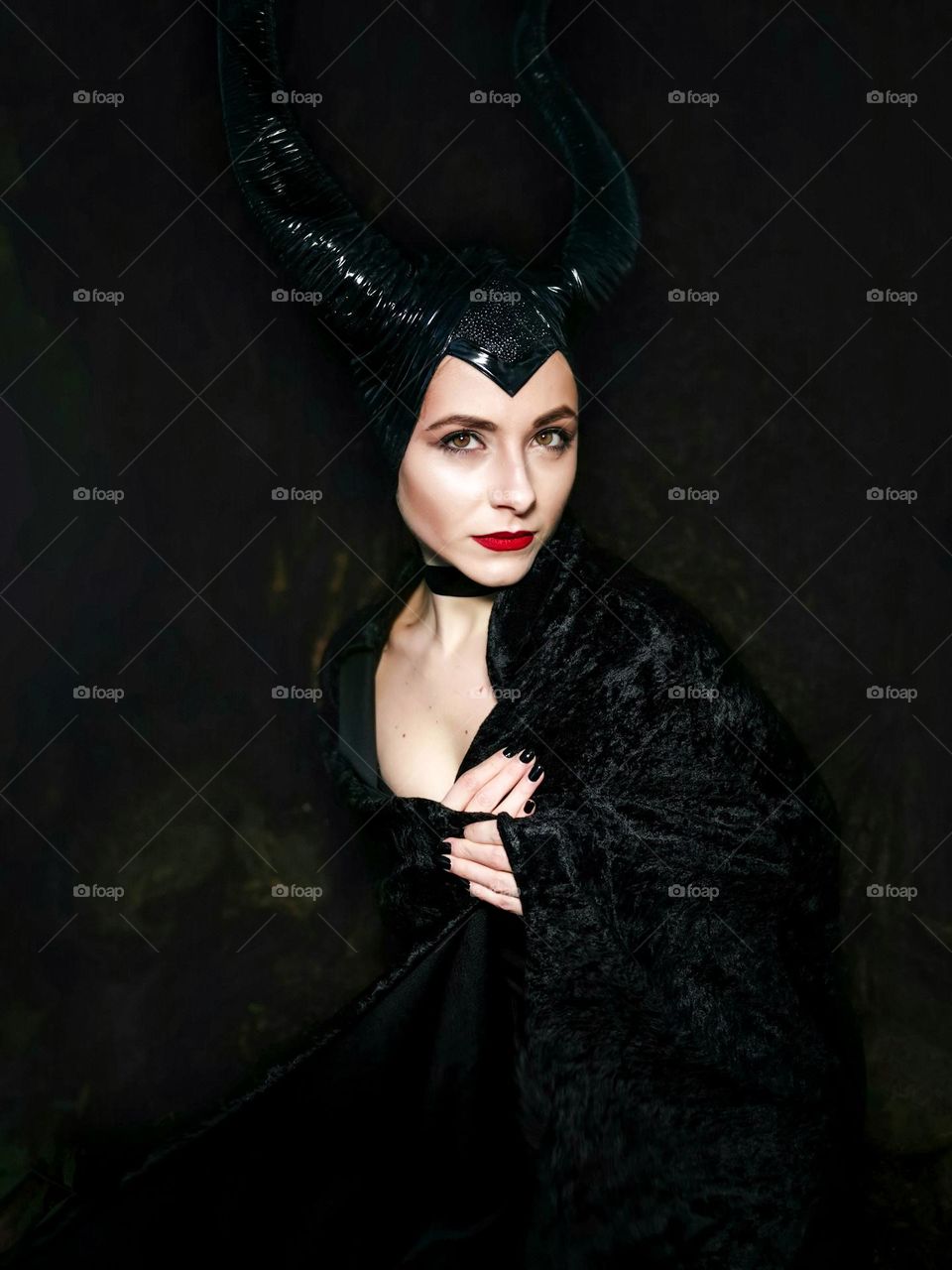 October - Halloween time. Cosplay. My beautiful model as Maleficent. The photo was taken on a smartphone Huawei mate 20 pro.