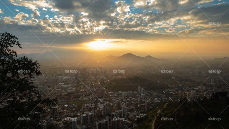 sunset in the metropolis covered by Po the fog and peeking from the top of the cerr