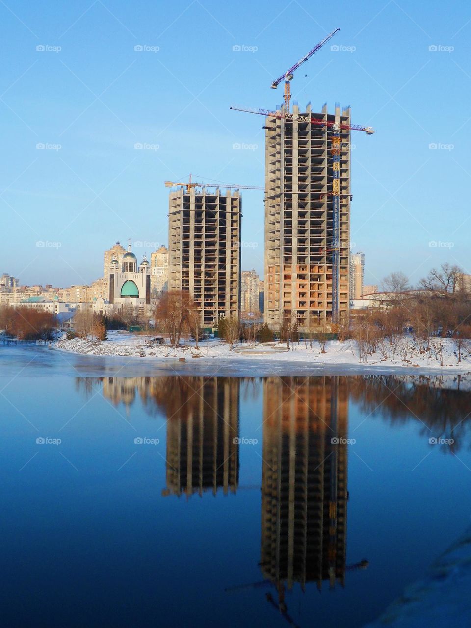 mirror reflection on the water of the houses