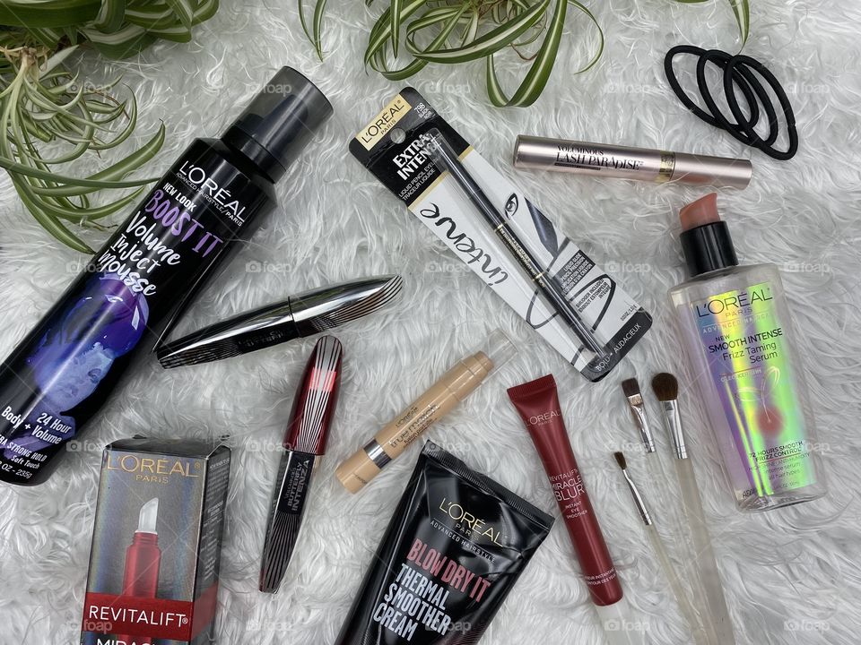 Studio shot of a variety of luxurious L’Oréal products taken from above