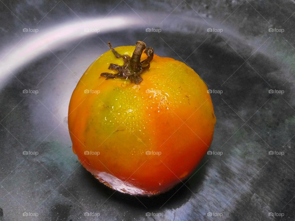 Fresh tomato fruit on the table