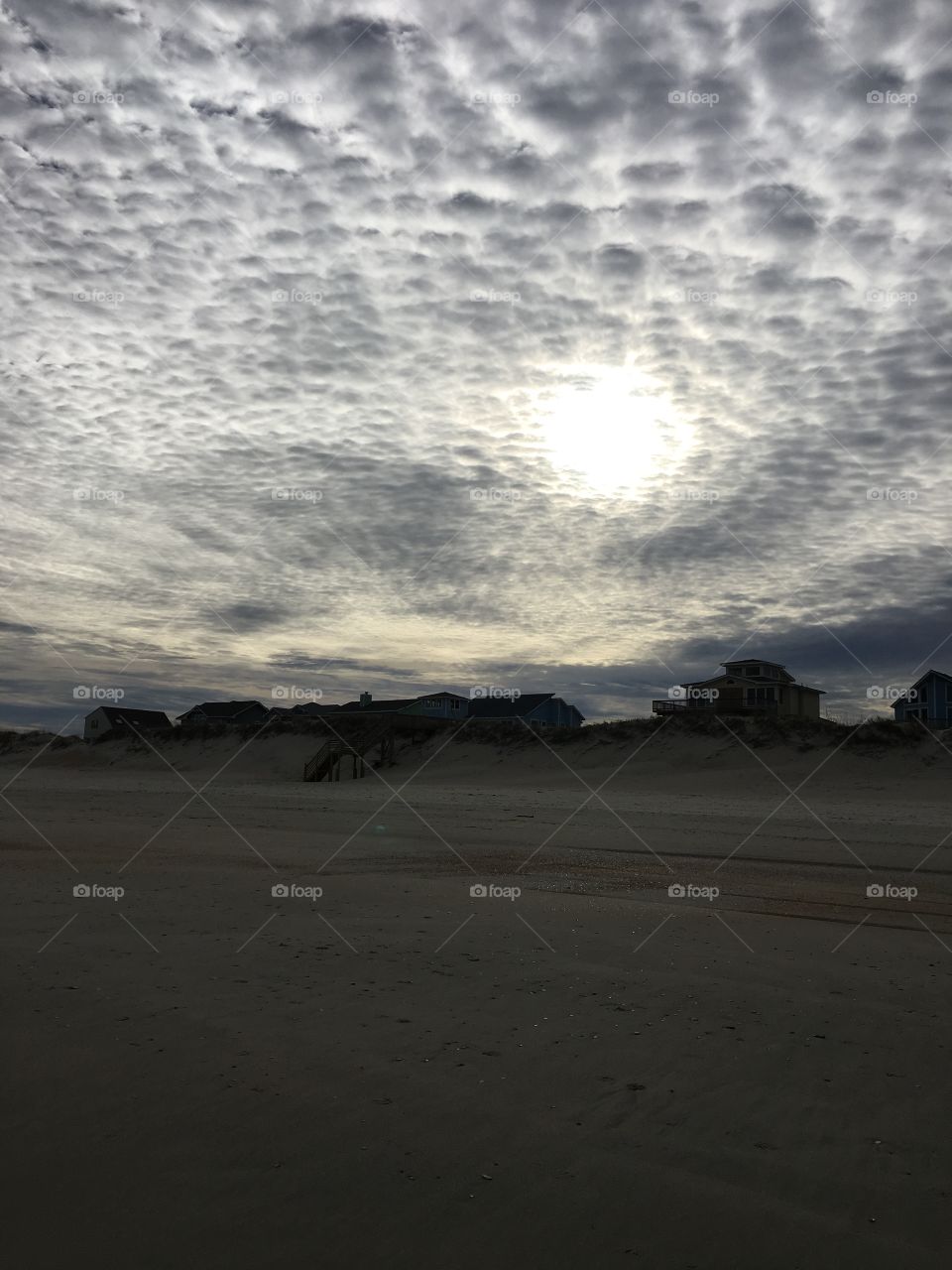 Sun over sand dunes