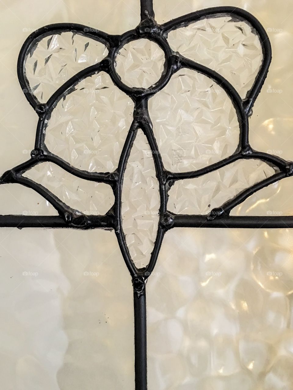 Cream textured stain glass window closeup antique Art Deco period, background image leaded glass 