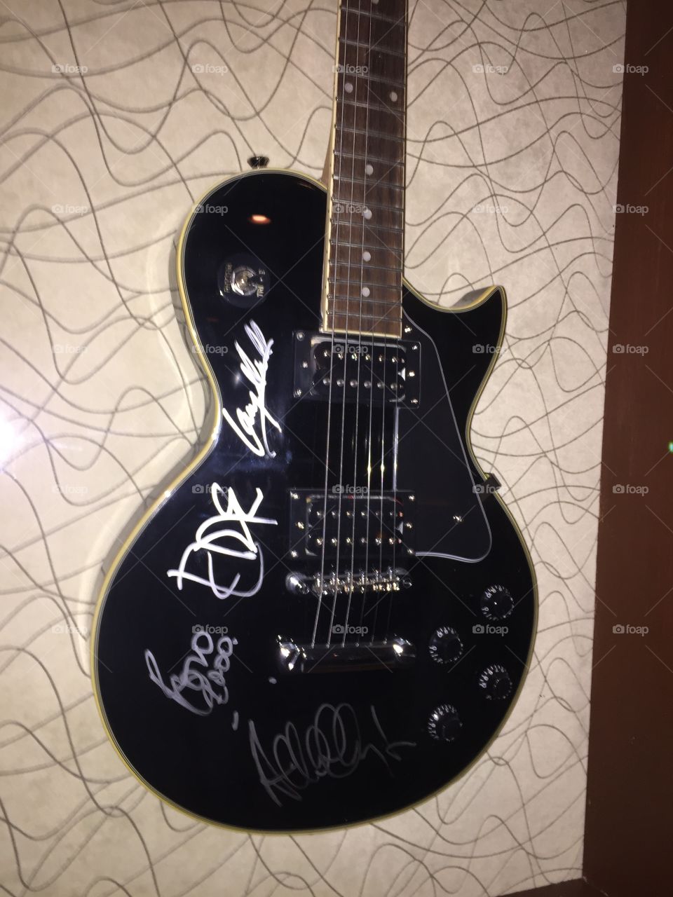 U2 signed guitar. In a wall in Sedona