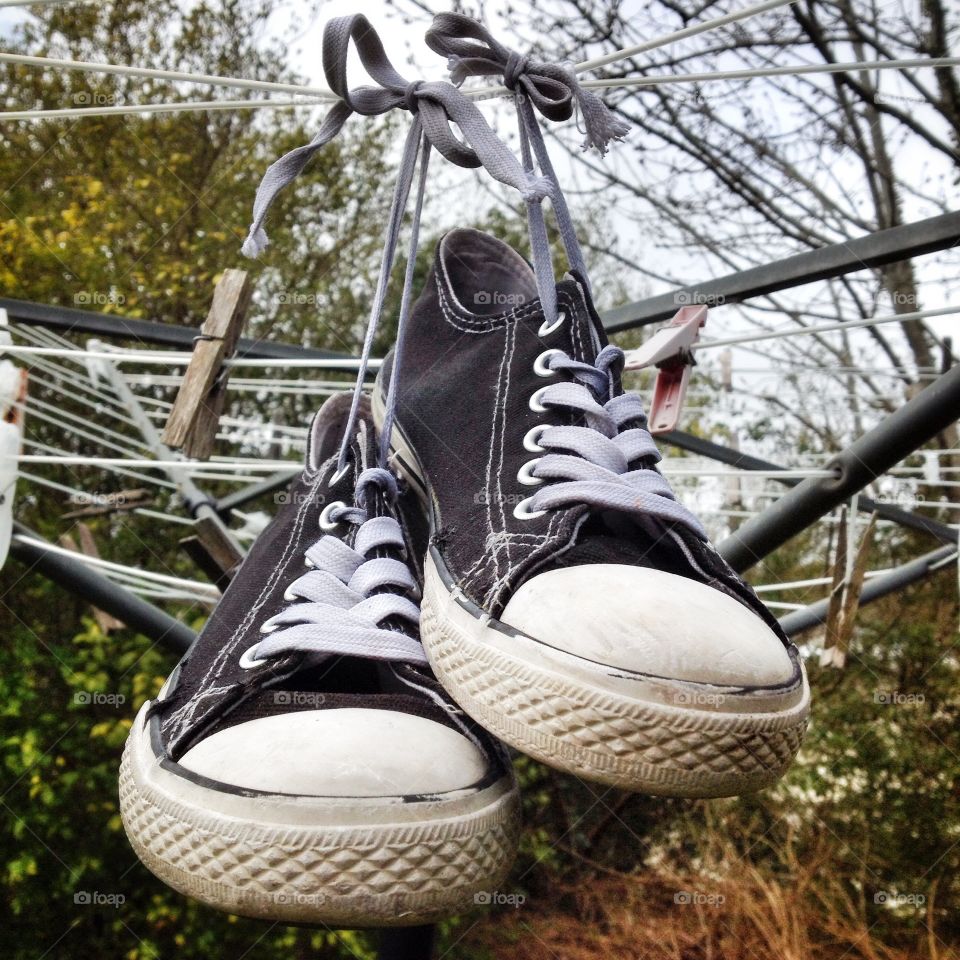 Shoes hanging to dry on a clothesline 