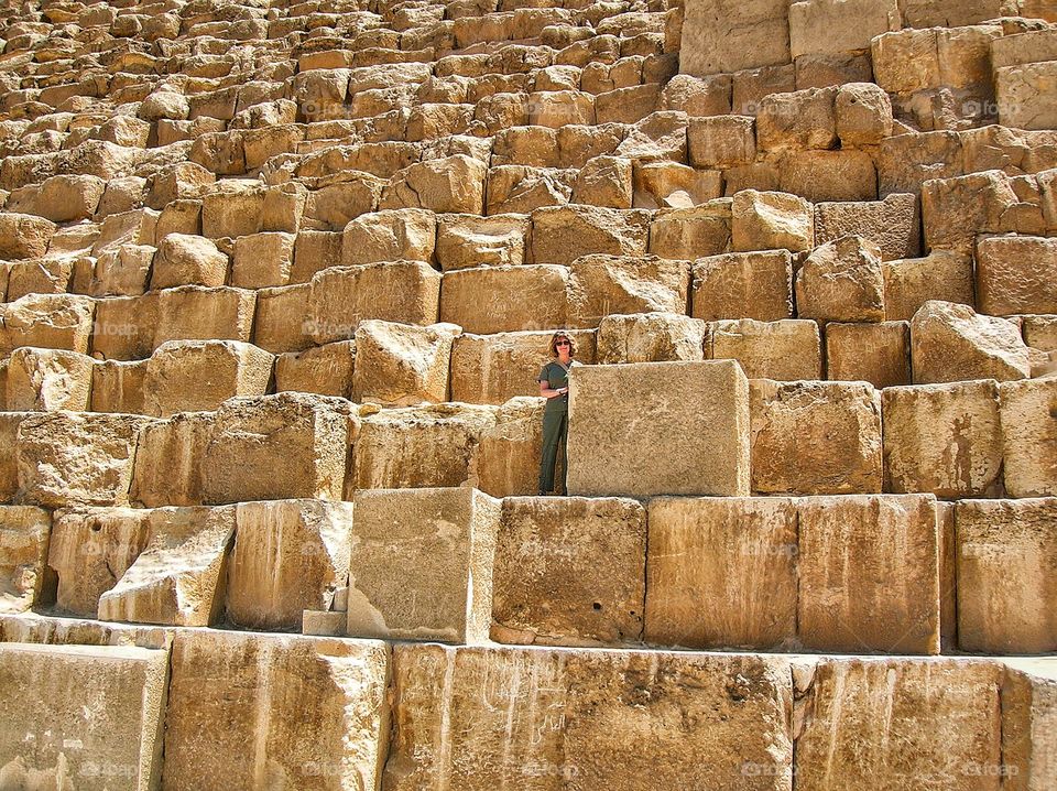 Standing amongst the giant stones of a Giza Pyramid. Egypt.