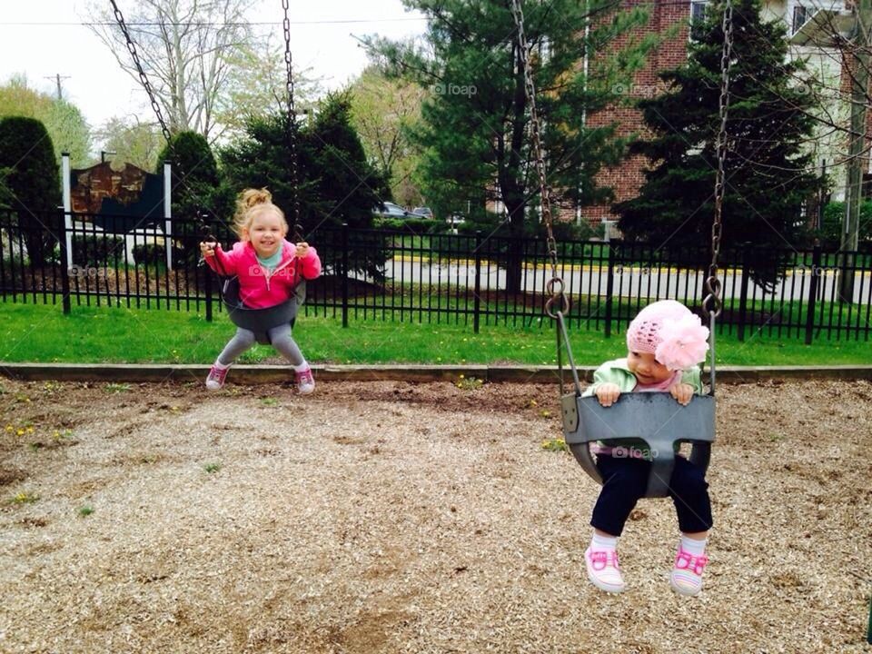 Sisters on Swings