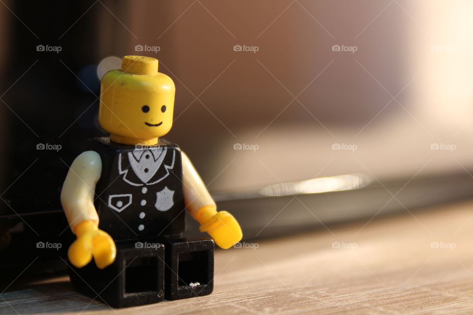 police Lego figure sitting down close-up