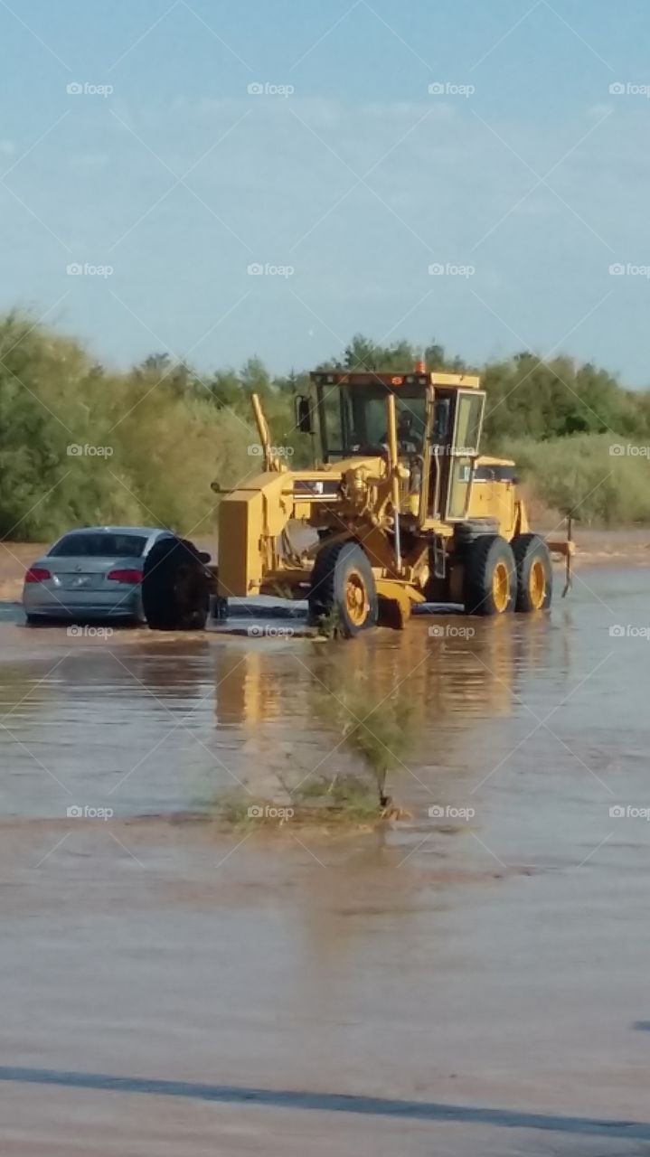 flooded road, protecting farmer