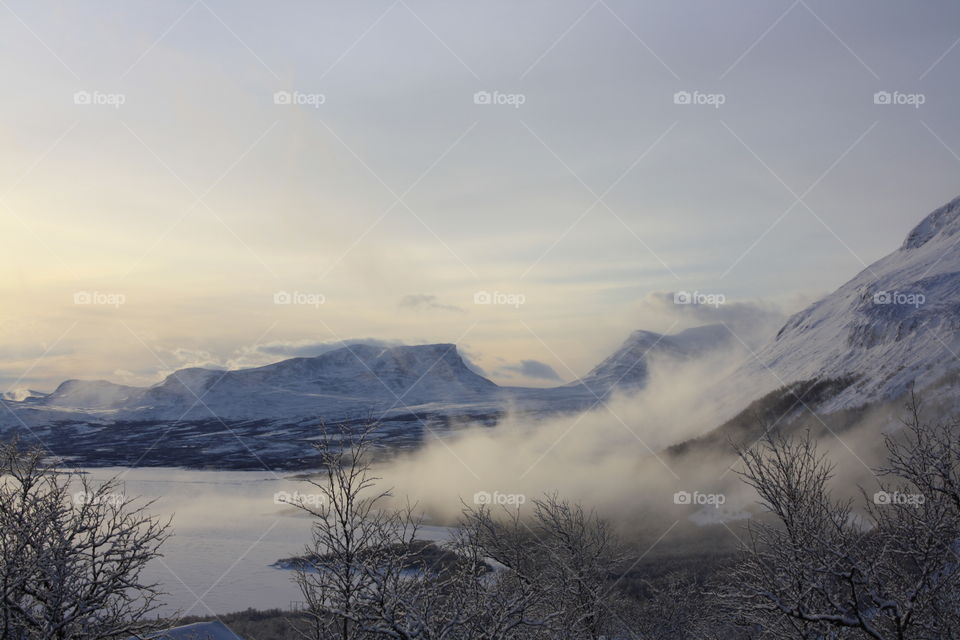 Fog covered the snowy mountain