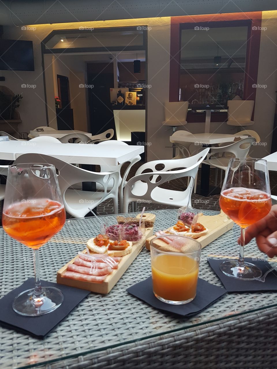 Appetizer with Spritz cocktails and finger food in a bar