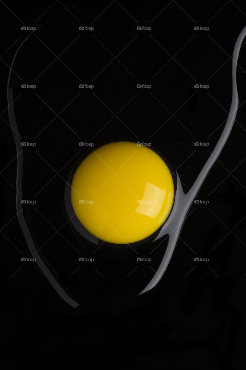 Yolk macro shot . top view.  Yellow color concept