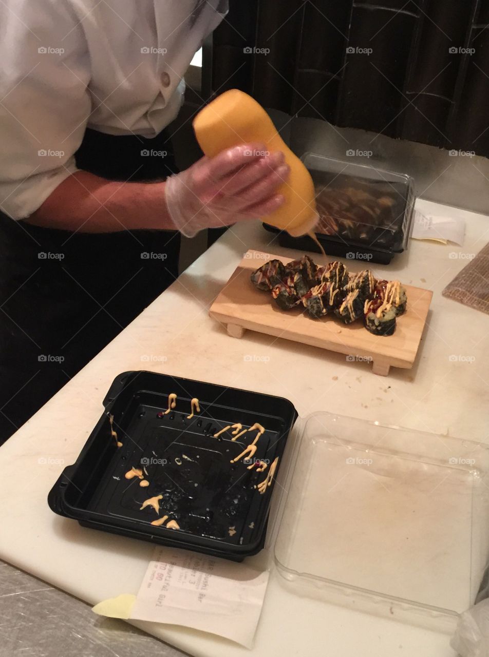 A chef preparing sushi
