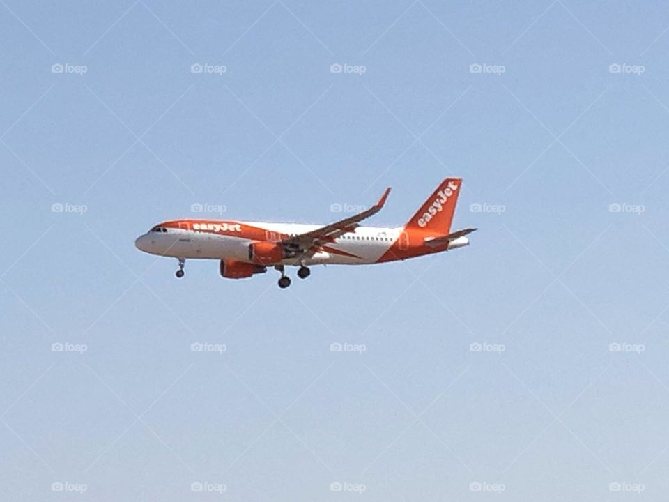 beautiful aircraft flying cross the blue sky