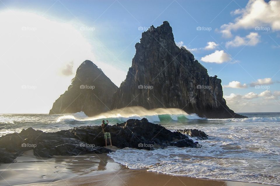 Rocks in the beach with waves 