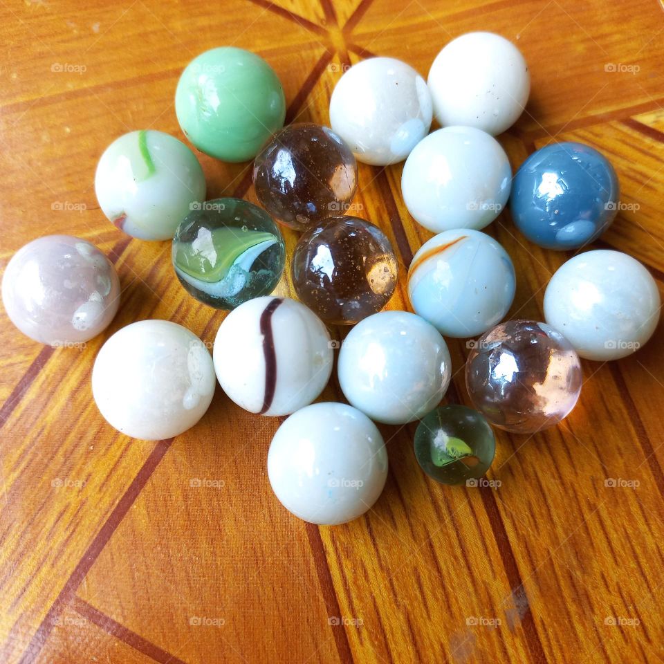 Small balls made of marble or glass clay for children's games