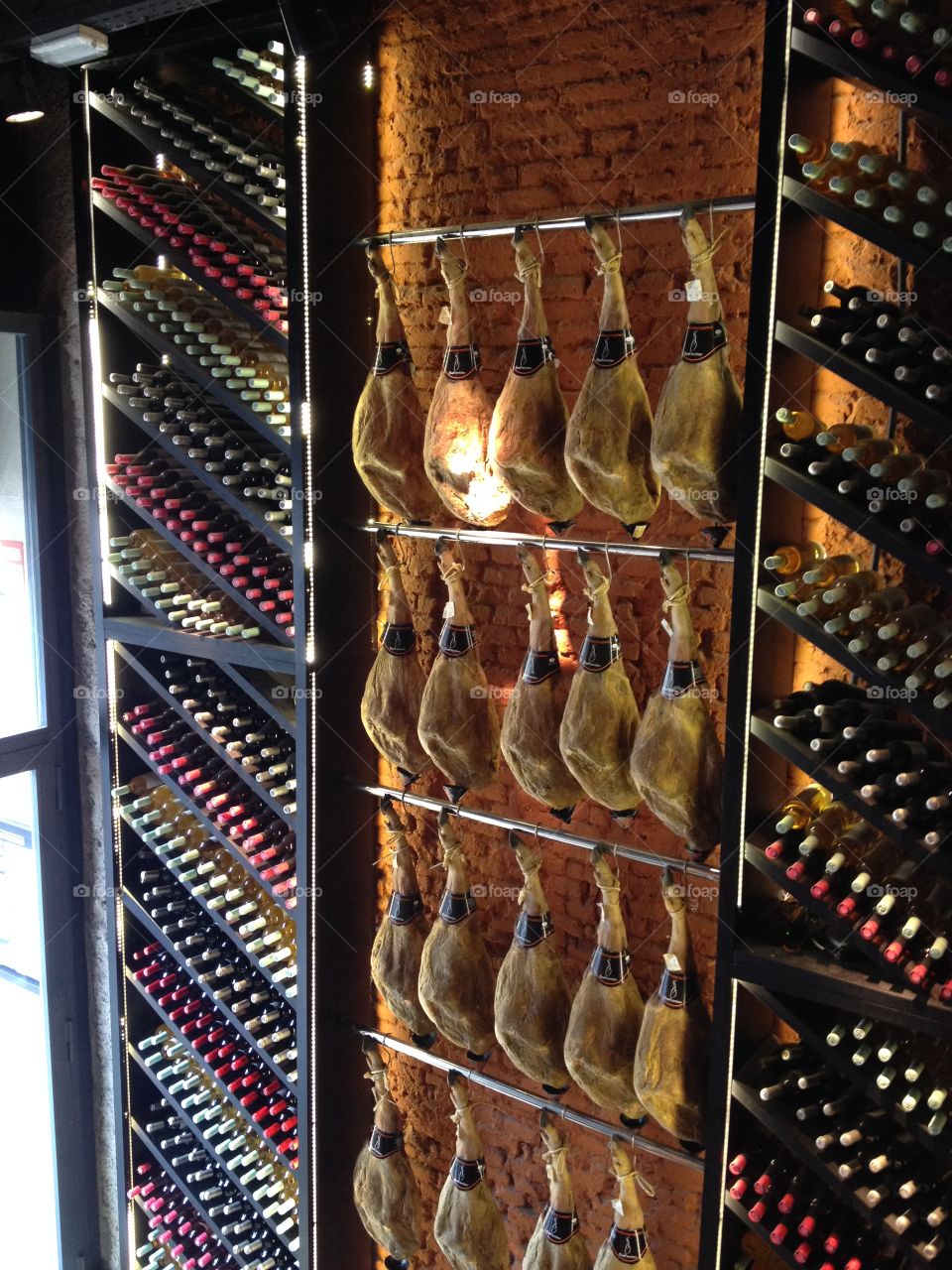 Spanish Jamón - Ham hanging on the wall in a restaurant