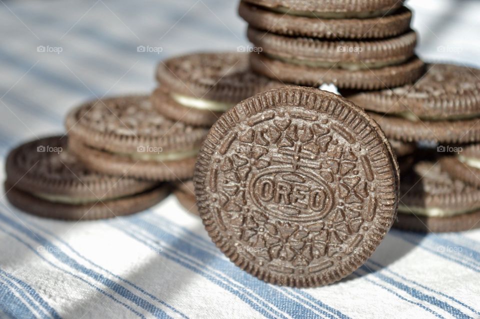 Oreo cookies on a blue striped background 