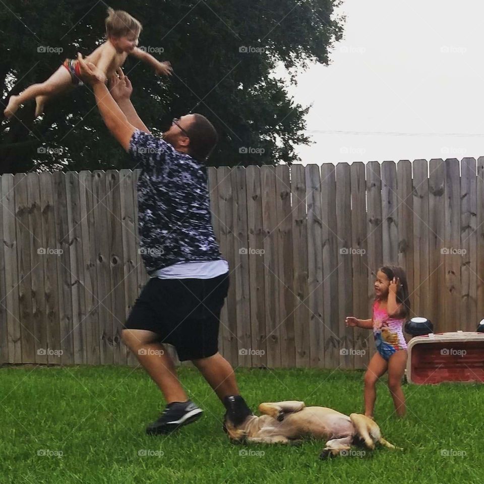 super dad. playing in the backyard