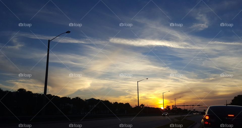 Clouds playing in the sunset