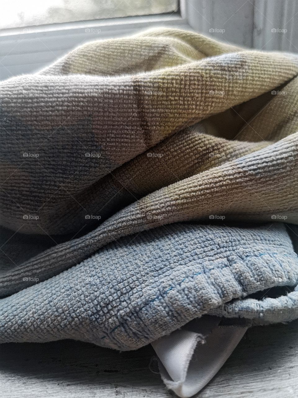 old blanket in window sill
