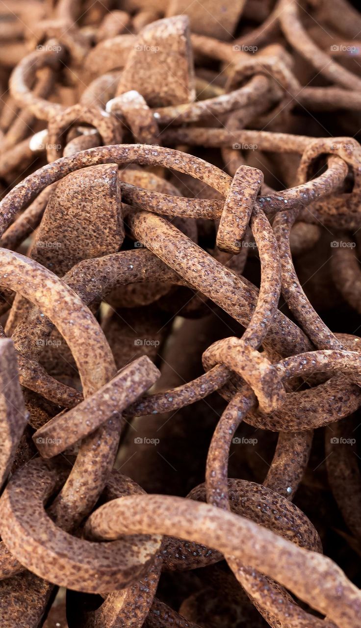 Rusty metal chains used in industrial fishing