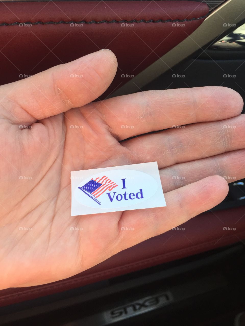 Sticker that says I Voted, with American flag on it.