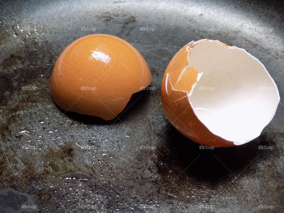 Egg shells on a frying pan