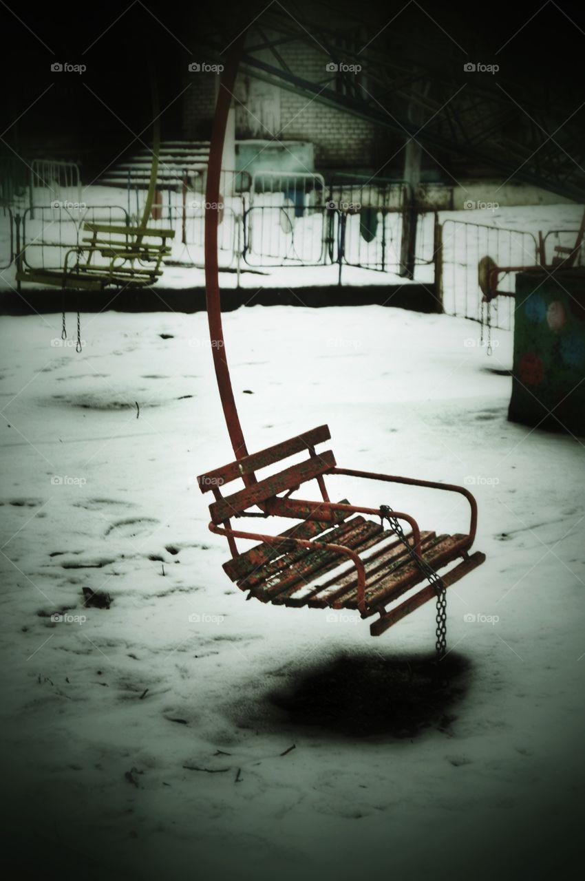 Empty swing in winter