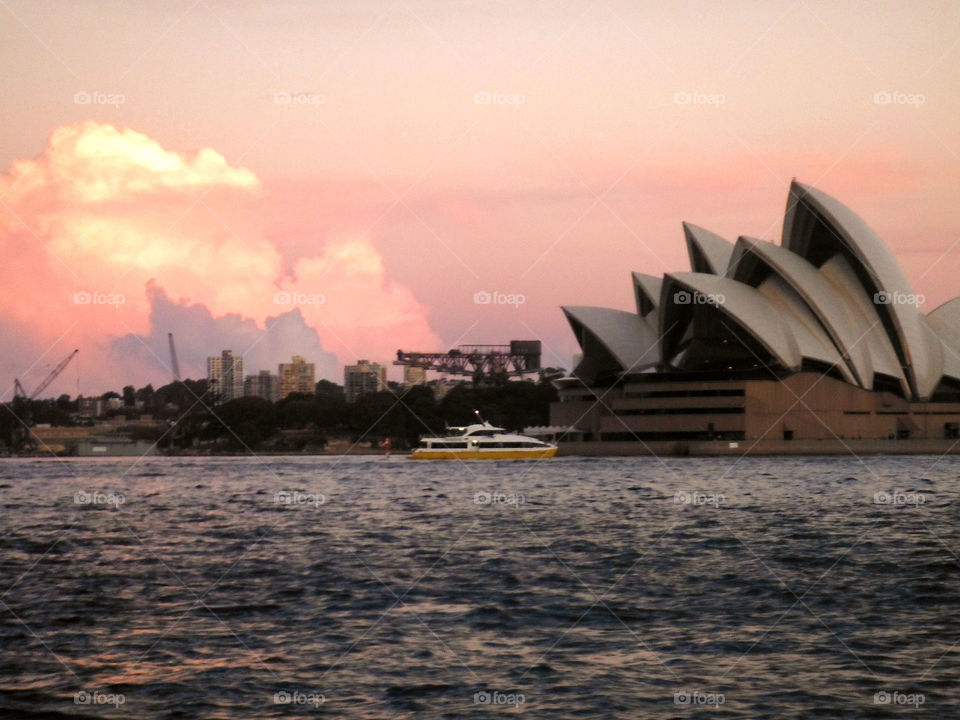 Sydney opera house. In front of beautiful sunset 