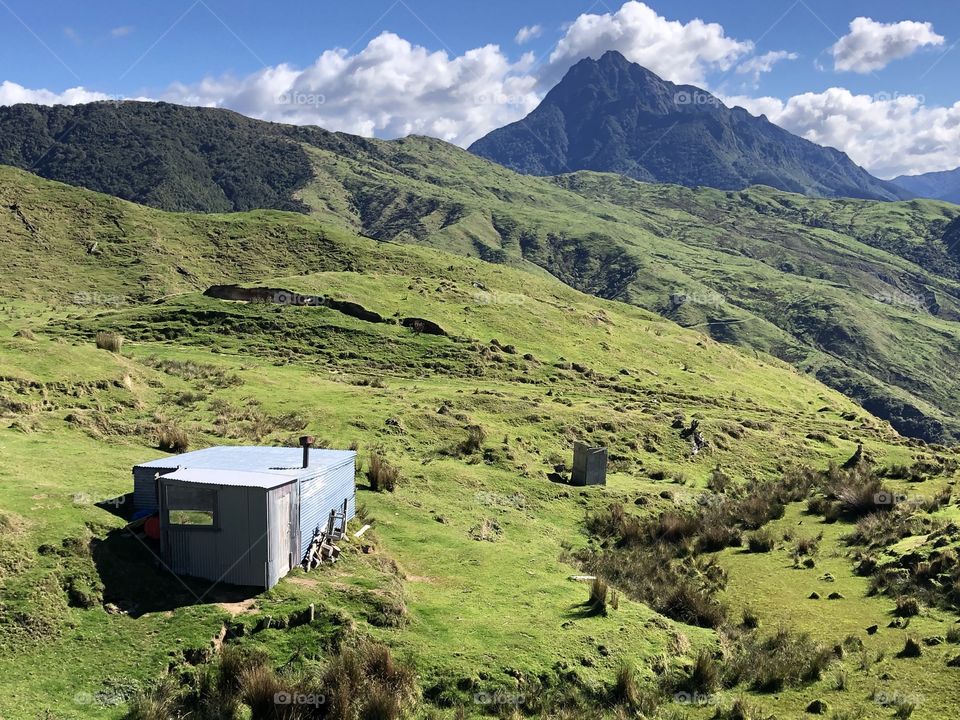 On a farm situated in rural New Zealand is a tin shack and long drop with the best view 