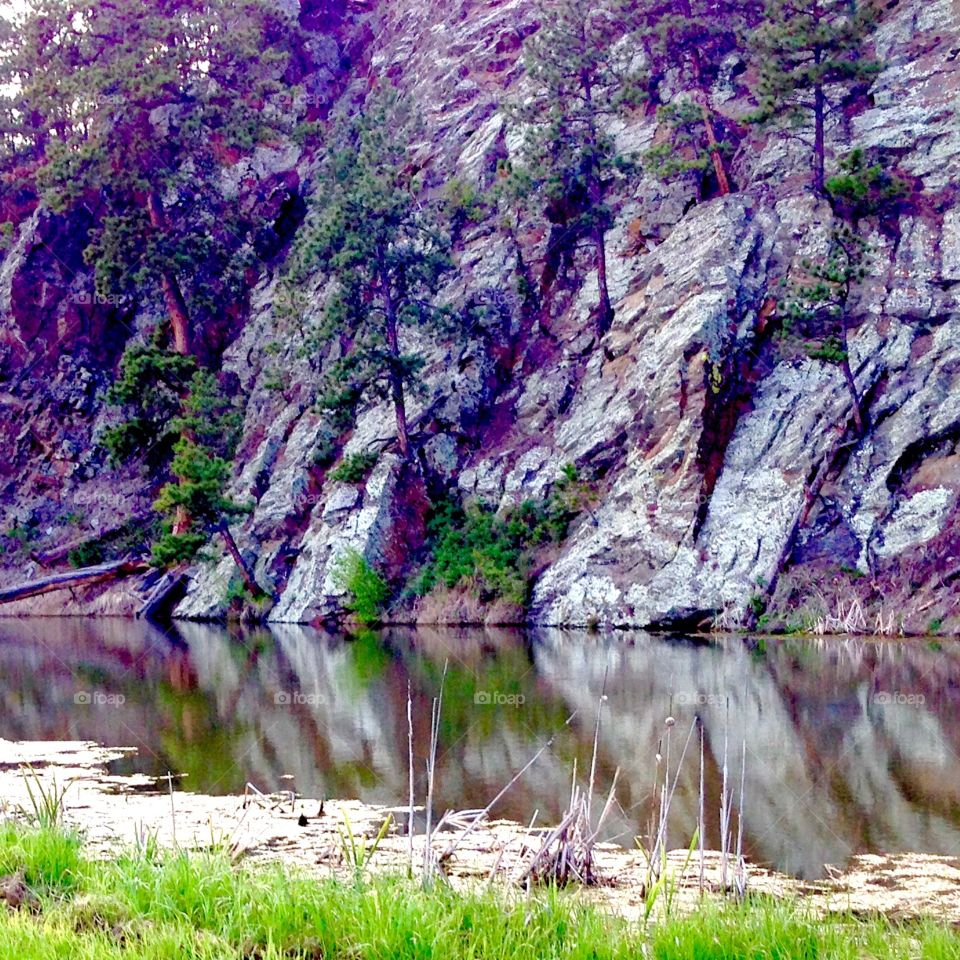 Granite. Small pond in front of a granite sheer