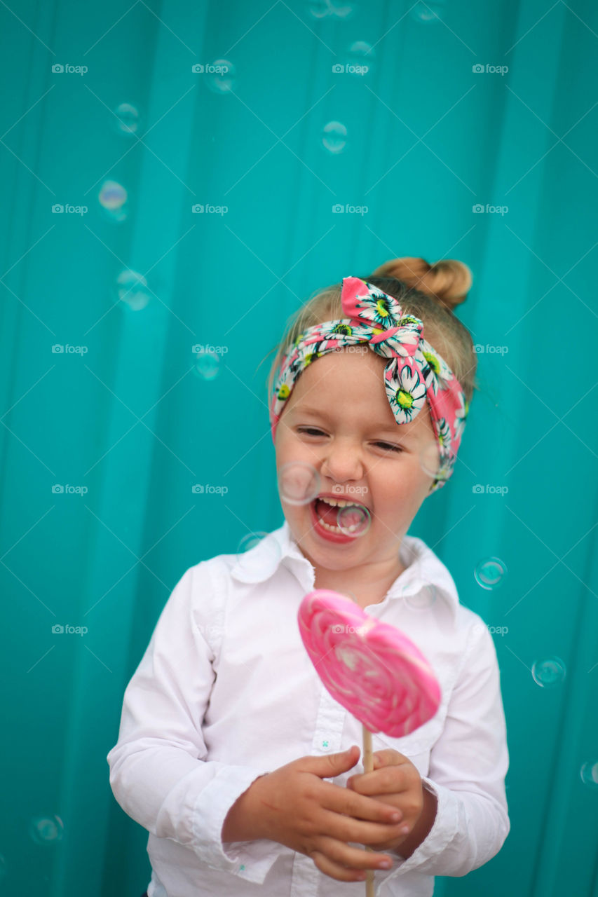 Happy day . What is better in life than bubbles, giant lolly pops, giggles and bright bold colors?!