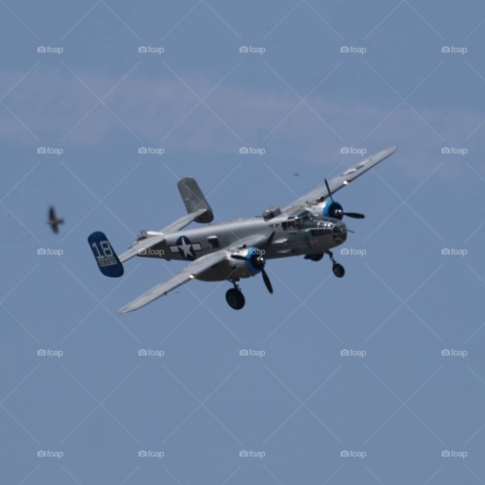 B25 bomber with gear down coming in for landing