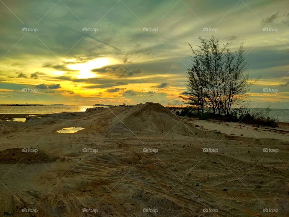 Sand dune sky and water