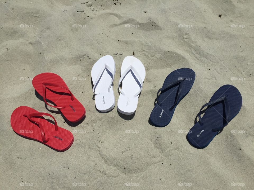 Flip-flops. Red white and blue flip-flops on the beach