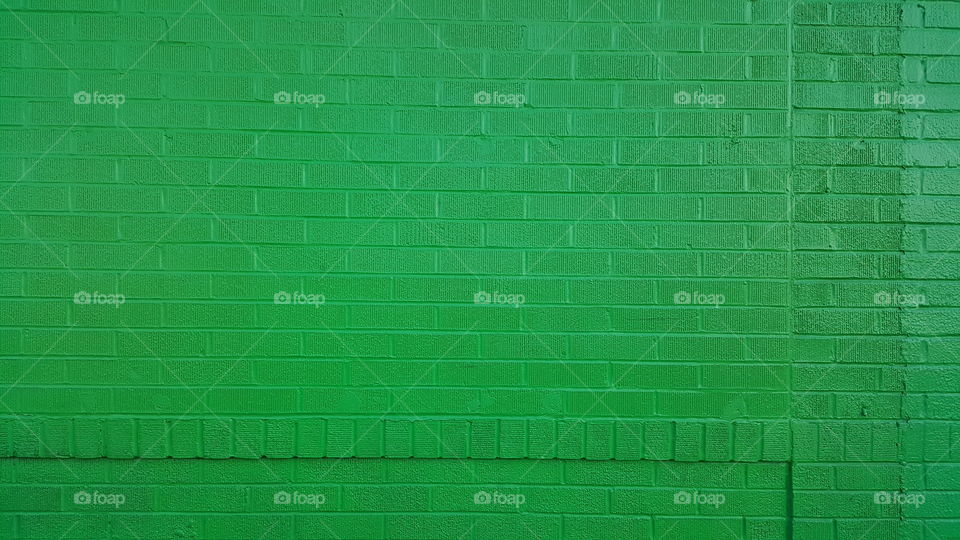 Full frame shot of green brick wall