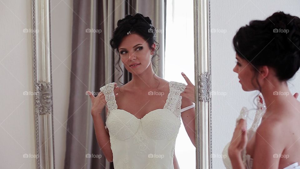 Bride near mirror 