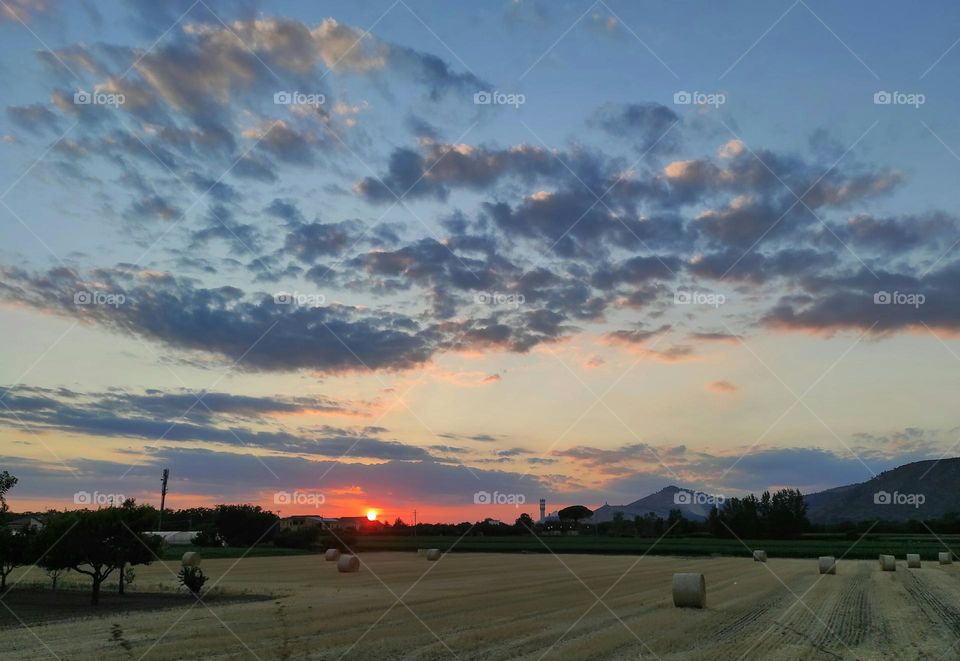 sunset in the countryside with clouds