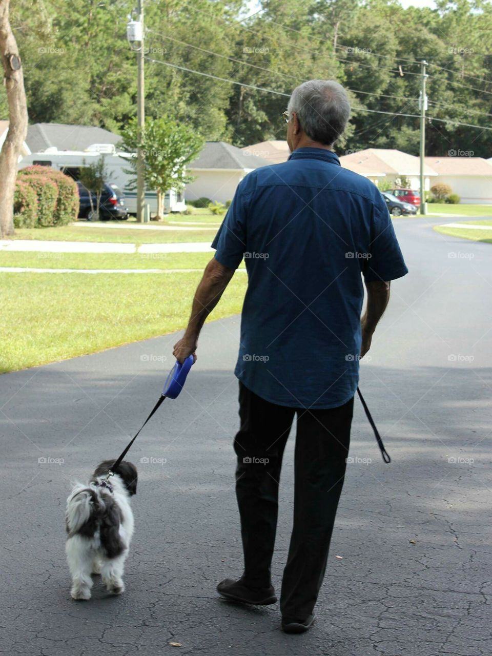My wonderful husband walking our dog.