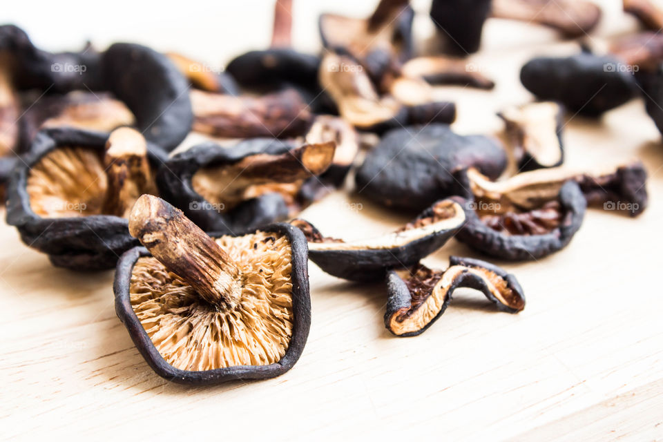 dried shiitake on chopping block