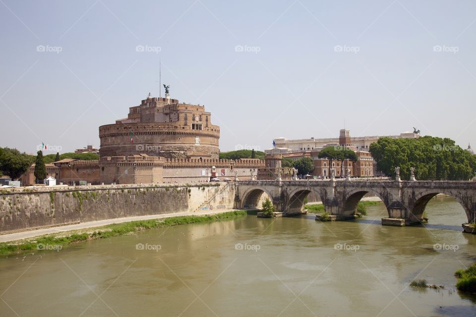 Tiber river runs through Rome . Castel Sant Angelo by the riverside. 