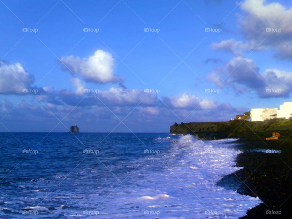 Volcanic  black sand beach of Stromboli Island ( Italy ).