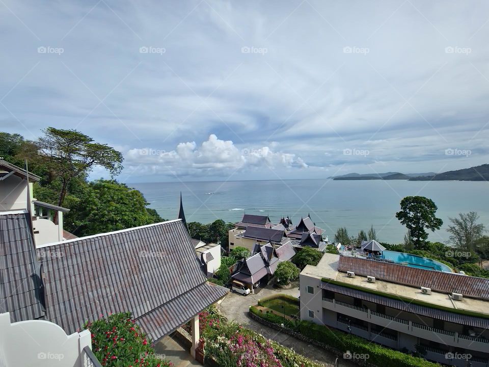 sun,ocean,greens and mountain