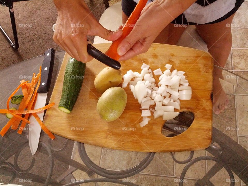 High angle view of person cutting vegetables