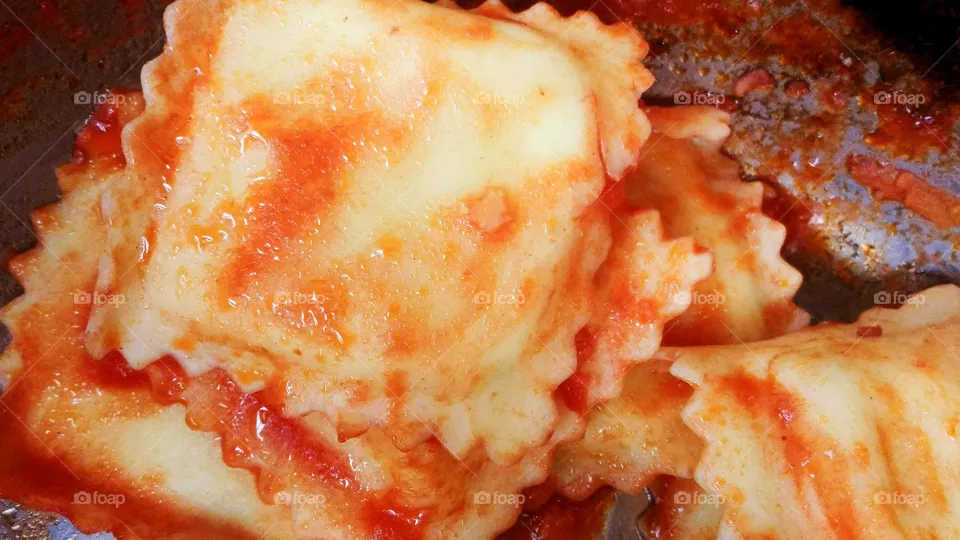 A close up of the Italian ravioli pasta with tomato sauce