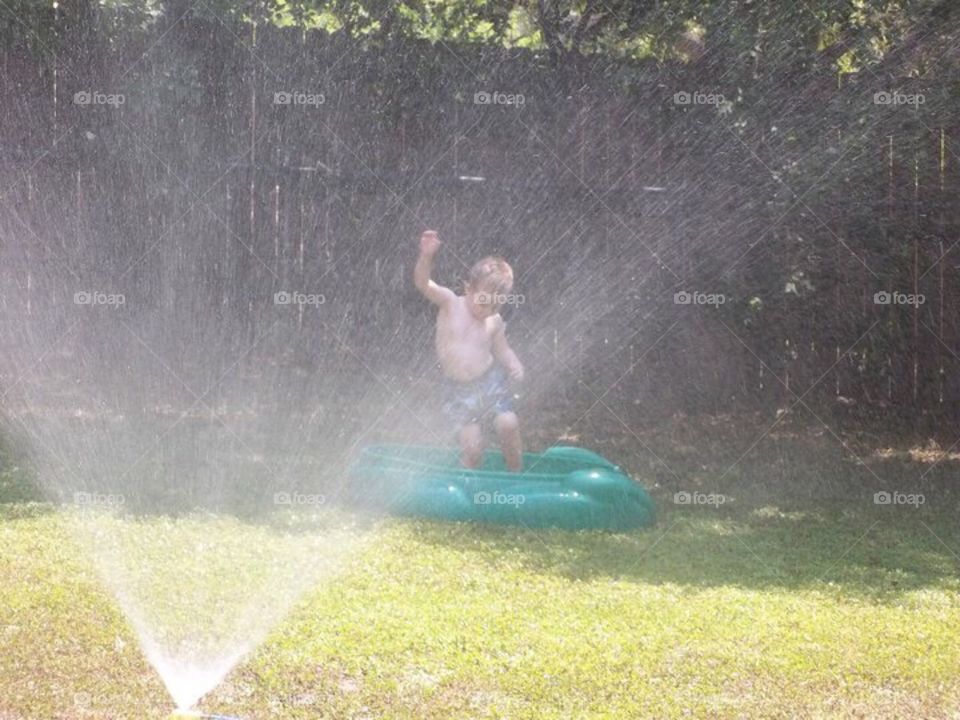 Fun in the sprinkler 