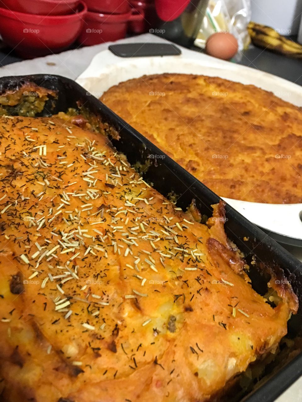 Homemade meatloaf topped with sweet potato and potato mash closeup